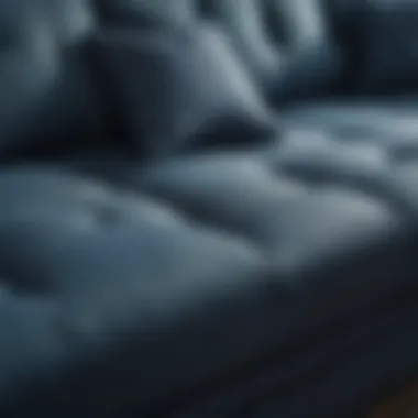 Close-up of a textured blue fabric sofa showcasing its rich detail and craftsmanship