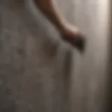 Close-up view of a textured wall being cleaned