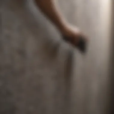 Close-up view of a textured wall being cleaned