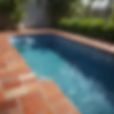 Vibrant tiled pool deck with tropical plants