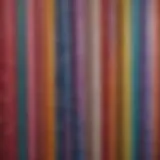 A vibrant selection of plastic shower curtains displaying various patterns