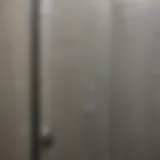 Close-up of a sparkling clean shower door reflecting light