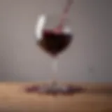 A cloth absorbing red wine spill on a table