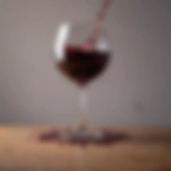 A cloth absorbing red wine spill on a table