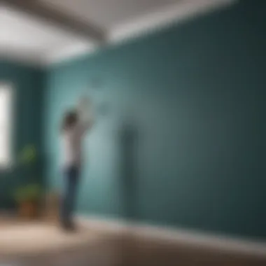 An interior designer applying Benjamin Moore teal paint on a feature wall