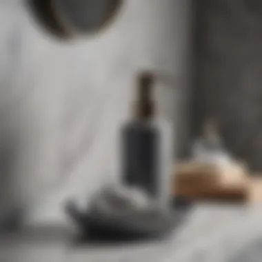 Stylish gray soap dispenser and dish on a marble countertop