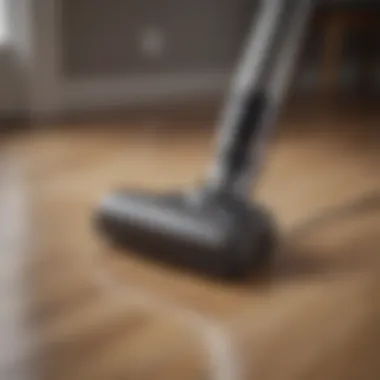 A sleek and modern rechargeable vacuum on a hardwood floor.