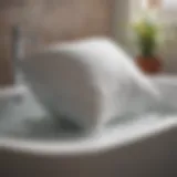 A soft pillow being gently washed in a basin of water