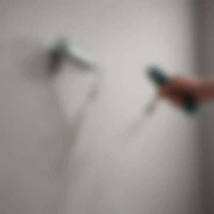 Close-up of a paint roller applying a smooth layer of paint on the wall