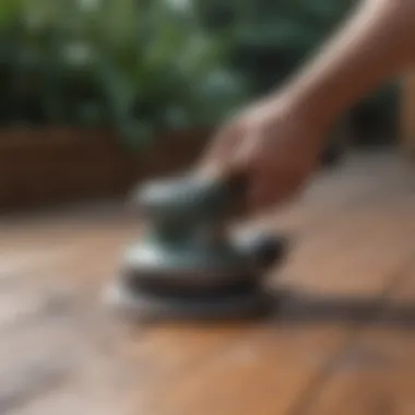 Close-up of an orbital sander in action on a deck surface